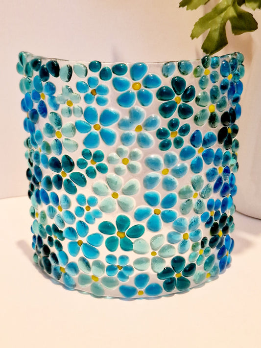 Fused glass suncatcher display in ditsy blue flower design