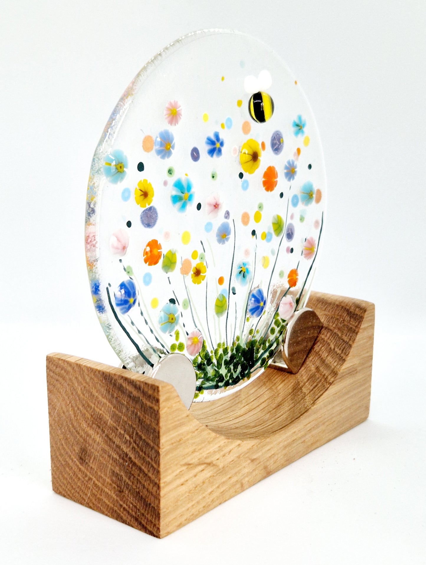 Small round meadow display on oak stand
