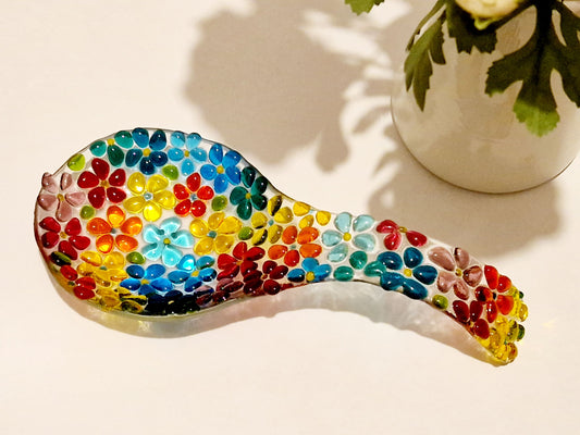 Multi-coloured spoon rest in ditsy flower design  top view